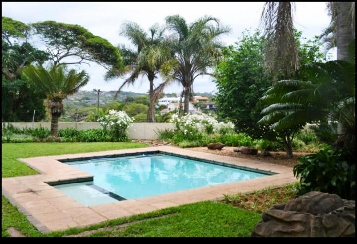 Outdoor swimming pool in the tropical garden