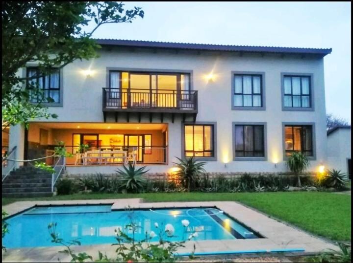Mahogany Villa Guesthouse in Salt Rock, Ballito at dusk with swimming pool